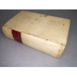A small cream velum bound volume: 'Les Memoires de Messire Philippe de Commines - Sr.. d'