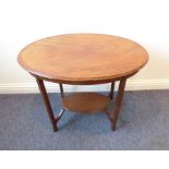 An Edwardian period occasional table together with a nest of three oak occasional tables: the oval