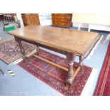 An early 20th century oak refectory table in 17th century style; the moulded top above four