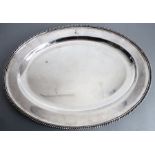 A large late 19th century oval silver-plated serving platter; gadrooned raised border and with