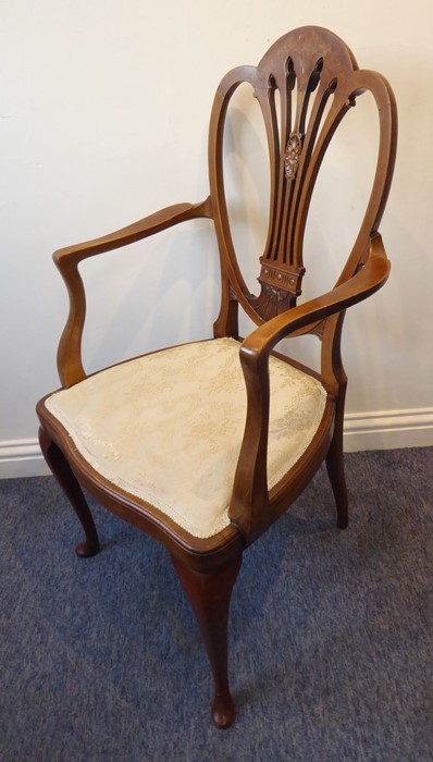 An early 20th century mahogany open armchair; the Hepplewhite-style pierced splat with marquetry
