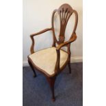 An early 20th century mahogany open armchair; the Hepplewhite-style pierced splat with marquetry