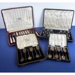 An early 20th century cased set of six silver-plate-bladed and mother of pearl handled tea knives