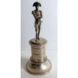 A late 19th/early 20th century silver-plated model of a standing Napoleon with crossed arms upon a