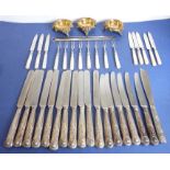 A large assortment of double-struck silver-plated handled table knives together with three 19th