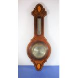 A Sheraton revival mahogany aneroid barometer and thermometer with inlaid shell design