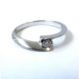 A diamond-set single stone ring, the brilliant-cut diamond set between bifurcated shoulders, the