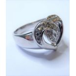 A diamond-set ring designed as an openwork heart, the upper section set with brilliant-cut diamonds,