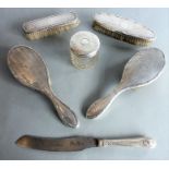 A lady's early 20th century four-piece silver-backed dressing table set together with an early