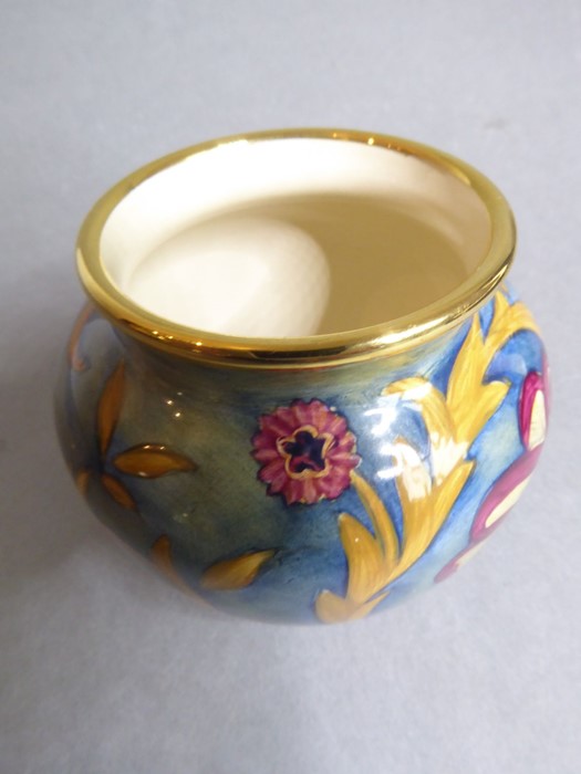 A miniature Moorcroft vase; finely hand-painted enamel fired onto copper, decorated with florid - Image 4 of 5