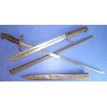 A French Model 1874 Gras bayonet and a WW1 German bayonet; the former with Chatellerault Armoury