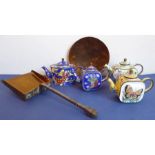 Four miniature enamelled teapots, a small handmade brass shovel with steel handle and a small