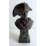 A well patinated figure of a standing bronze Napoleon wearing bicorn hat and with arms crossed,