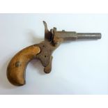 A Velo-dog cap pistol 'Le Mignon'; stamped '80' on trigger, stock and other parts, walnut handle (