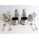 An early 20th century cased hallmarked silver cruet set by Mappin & Webb: two lidded mustards and