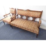 An Edwardian period upholstered sofa with companion armchair; carved rosewood, boxwood-strung and