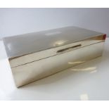 A silver cigarette box; cedar-lined and with one separator, assayed Birmingham 1965 (464g) (15.5 x