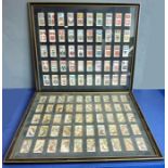 Two Hogarth-framed and glazed complete sets of Player's cigarette cards including various flags