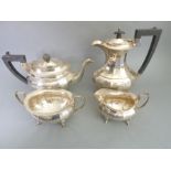 A heavy four-piece hallmarked silver tea service comprising teapot, hot-water jug, two-handled sugar