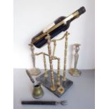 An assortment of four: a brass wine-pourer on a marble base, a pair of brass and silver-plated