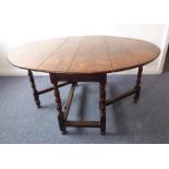 A late 17th/early 18th century oval oak dropleaf dining table; single end drawer and bobbin-turned