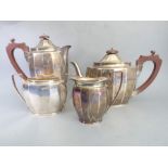 A hallmarked silver four-piece tea service comprising teapot, hot-water pot, two-handled sugar and