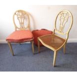 A pair of 18th century-style (later) painted salon chairs; the ovals backs with pierced splats above