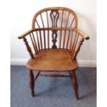 A mid-19th century ash Windsor chair; pierced splat, ash bow and elm seat, turned tapering