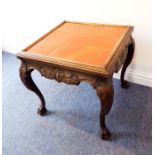 An orange tile-topped and carved oak occasional table; the well-defined cabriole legs terminating in