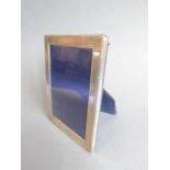 A hallmarked silver photograph frame (exterior 15.5cm x 11.75cm, interior 13cm x 9cm)