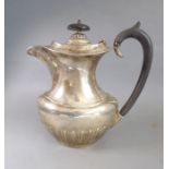 A heavy early 20th century hallmarked silver hot-water jug; maker's mark E.V, Sheffield assay