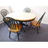 A green-painted and natural wood kitchen table and chair set; the extending table on a large bulbous