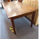 A stained hardwood dining table; cleated ends and sides and geometric-style decoration to the top,