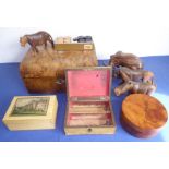 Four wooden boxes and four well carved African animals, together with a set of draughts. To