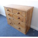 A late 19th century waxed pine chest; moulded top above two half-width and three full-width