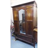 An Edwardian mahogany, chequer-strung and marquetry wardrobe; the outset cornice above central