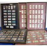 Five sets of Hogarth-framed and glazed cigarette cards; soldiers in battle, Antarctic expeditions