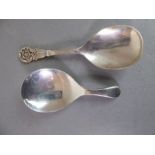 Two silver caddy spoons: Birmingham 1956, maker's mark J.B.C.&S. and Sheffield 1922, maker's mark