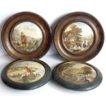 Two pairs of circular framed pot lids; two oak-framed pot lids in Prattware style and two ebony-