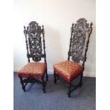 A fine pair of late 19th century carved oak chairs in late 17th century Charles II-style; each