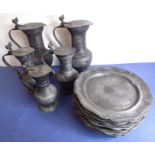 Five graduated lidded pewter jugs; the thumb-pieces modelled as dual acorns, together with twelve 9"