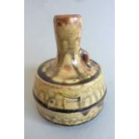An unusual Winchcombe Pottery vase by John Jelfs; tall slightly flaring neck and a larger circular