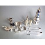 A small selection of silver plate to include a baluster-shaped caster, mustard and salt, sugar