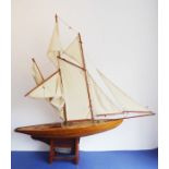 A fine early to mid-20th century six-sail custom-built pond yacht on stand; complete with £530