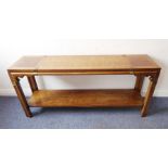 A modern Chinese wood and brass mounted console / altar-style table; long and low design, figured