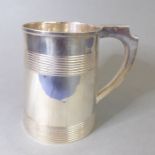 A heavy, early 19th century, hallmarked-silver tankard; tapering cylindrical form with two bands