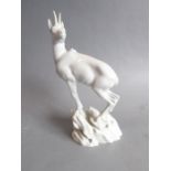 A fine white-glazed Viennese porcelain model of a chamois upon rocks; impressed marks and blue