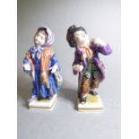 A pair of late 19th century hand-decorated Volkstedt (German) porcelain figure models of a young boy