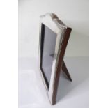 A hallmarked silver easel photo frame (16.5cm x 12cm)