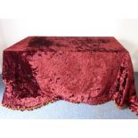 A burgundy crushed velvet/een bed cover lined with heavy gold crepe and with pom-pom edging (320cm x